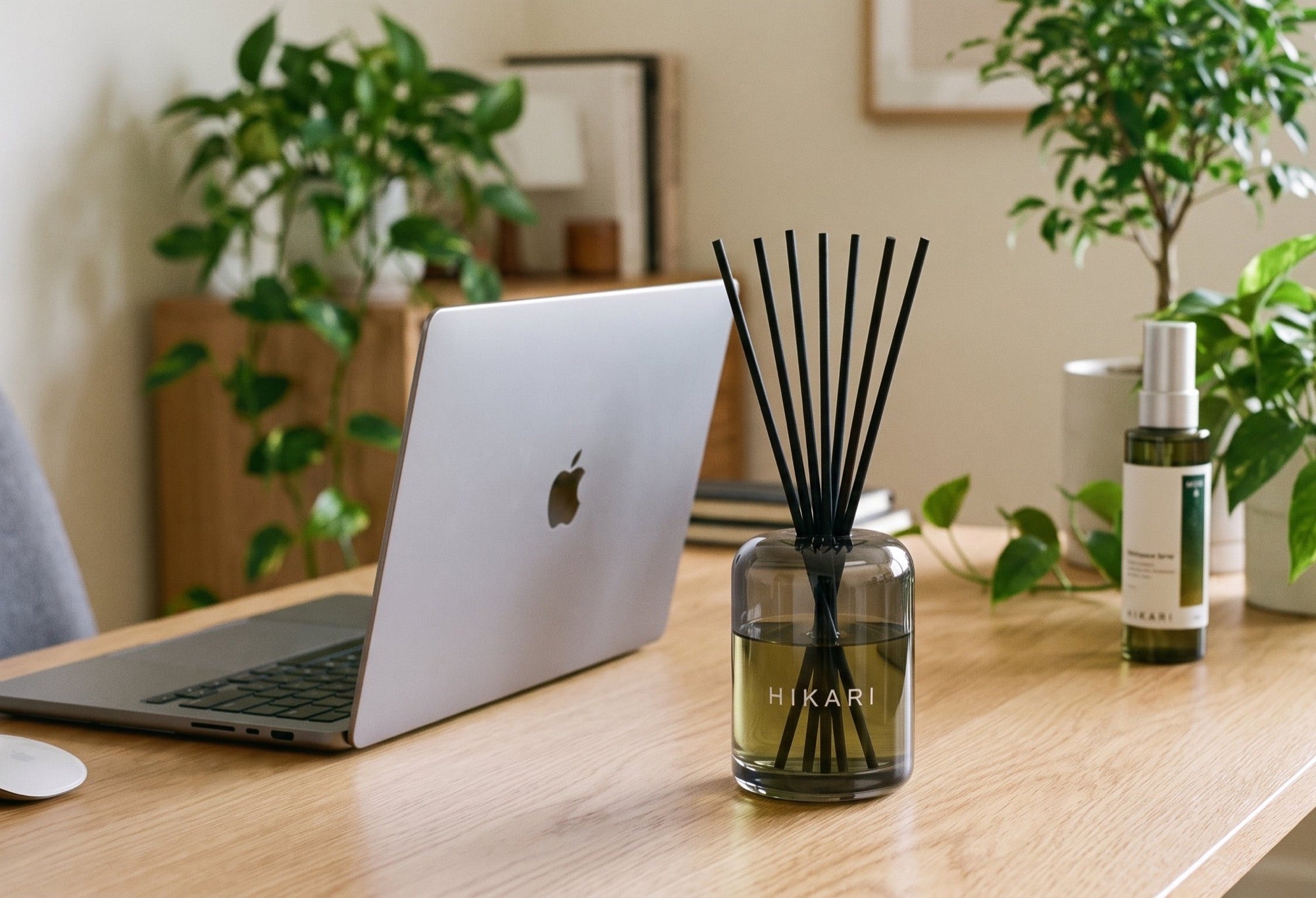 MORI reed diffuser on a morning desk beside a laptop and coffee